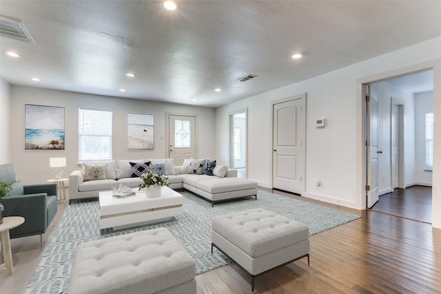 8919 San Fernando Way, Dallas, TX 75218 - living room with wood finished floors, baseboards, and recessed lighting