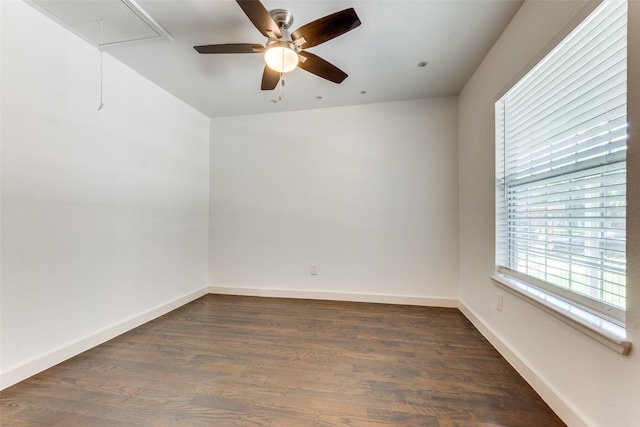 8919 San Fernando Way, Dallas, TX 75218 - empty room featuring attic access, a ceiling fan, dark wood-type flooring, and baseboards