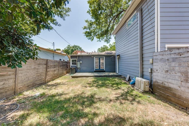 8919 San Fernando Way, Dallas, TX 75218 - view of yard featuring a wooden deck, ac unit, and central air condition unit