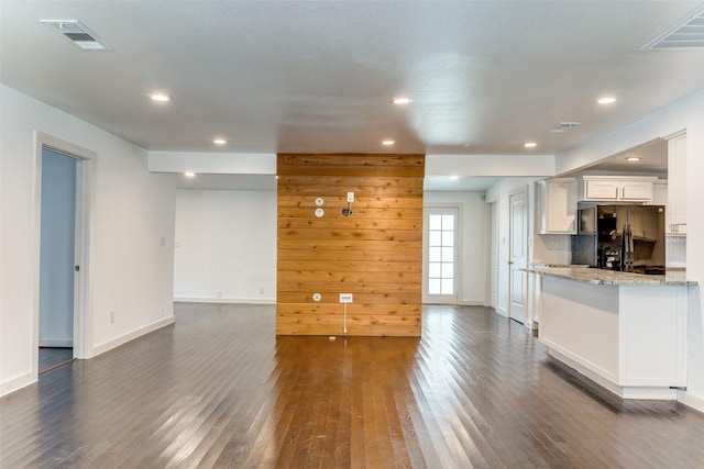 8919 San Fernando Way, Dallas, TX 75218 - unfurnished living room featuring dark wood-style flooring, recessed lighting, and baseboards