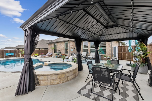 509 Oleander Dr, Royse City, TX 75189 - view of pool with a gazebo, a fenced backyard, a patio, a pool with connected hot tub, and outdoor dining area