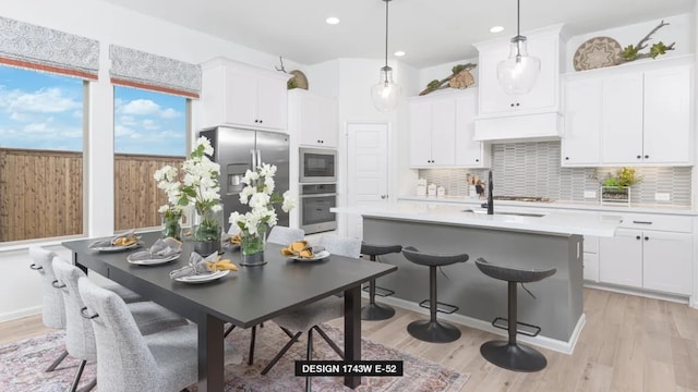 3501 Holly Hill Ln, Little Elm, TX 75068 - kitchen with stainless steel appliances, tasteful backsplash, light countertops, white cabinets, and recessed lighting