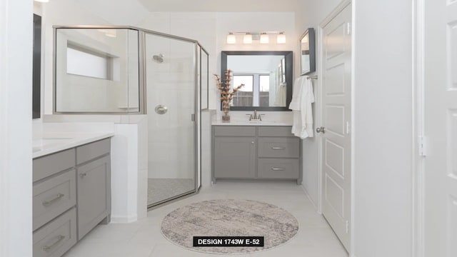 3501 Holly Hill Ln, Little Elm, TX 75068 - bathroom featuring a shower stall, two vanities, and tile patterned flooring
