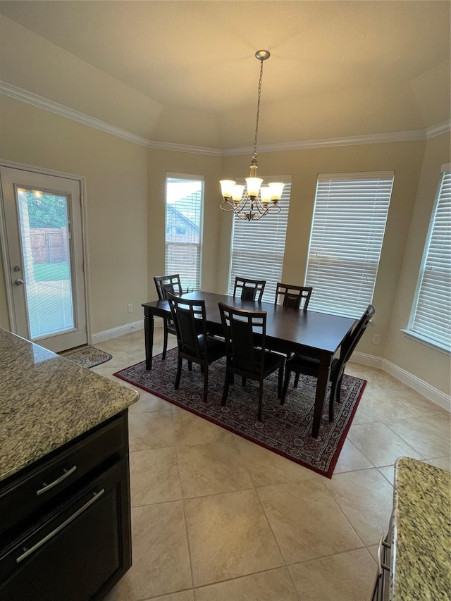 340 Prince John Dr, Saginaw, TX 76179 - dining area with a chandelier, crown molding, light tile patterned flooring, and baseboards