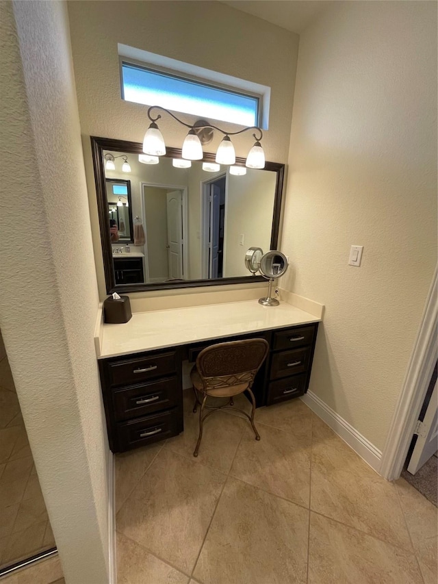 340 Prince John Dr, Saginaw, TX 76179 - bathroom with tile patterned floors, vanity, a textured wall, and baseboards