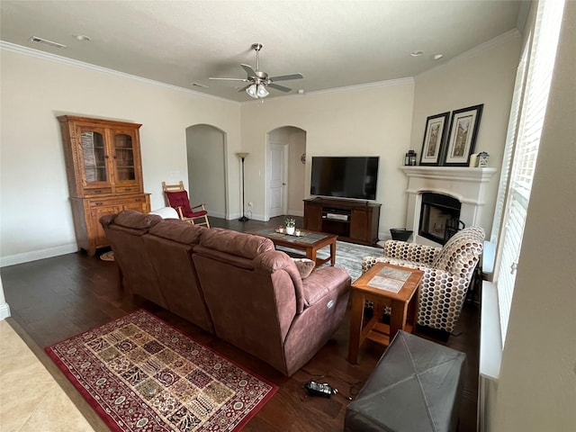 340 Prince John Dr, Saginaw, TX 76179 - living area with arched walkways, ceiling fan, ornamental molding, baseboards, and a fireplace