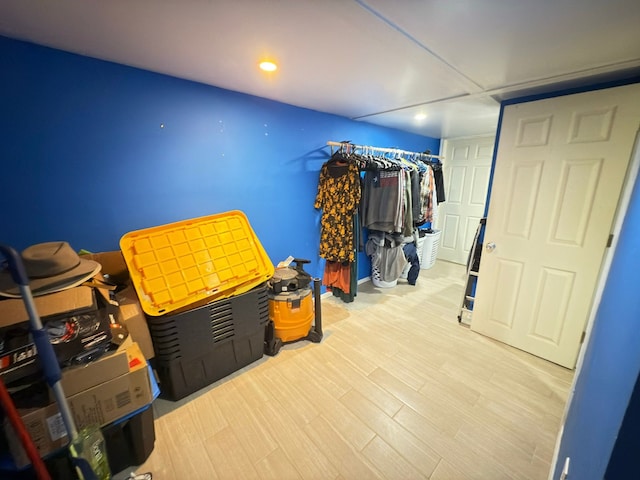 interior space featuring wood finished floors and recessed lighting