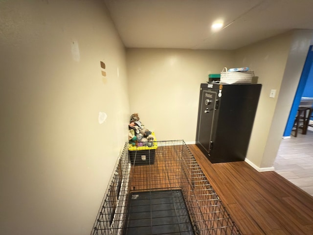 kitchen with wood finished floors and baseboards