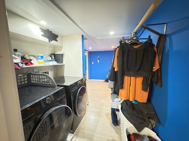 laundry area with washer and dryer, recessed lighting, and wood finished floors
