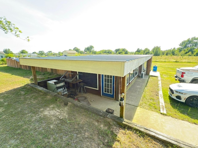 view of side of home featuring a yard