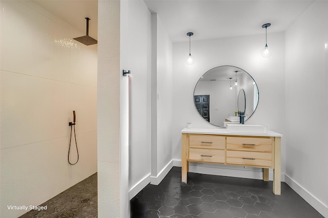 1014 Eagles Ridge Ct, Weatherford, TX 76087 - bathroom with vanity, a walk in shower, tile patterned floors, and baseboards