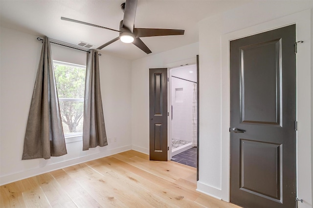 1014 Eagles Ridge Ct, Weatherford, TX 76087 - unfurnished bedroom with light wood finished floors, connected bathroom, baseboards, and a ceiling fan