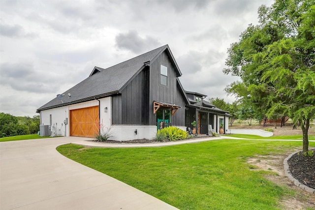 1014 Eagles Ridge Ct, Weatherford, TX 76087 - view of home's exterior with central air condition unit, driveway, a yard, roof with shingles, and a garage