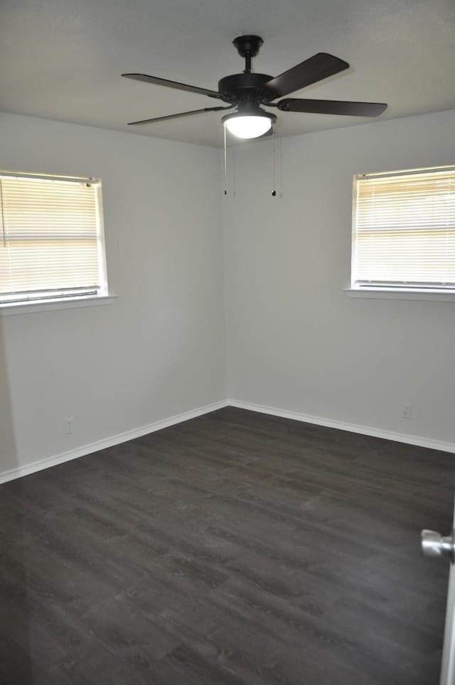 412 Poplar St, Italy, TX 76651 - spare room with ceiling fan, plenty of natural light, wood finished floors, and baseboards