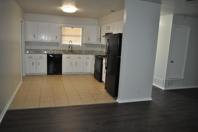 412 Poplar St, Italy, TX 76651 - kitchen featuring black appliances, white cabinetry, a sink, and under cabinet range hood