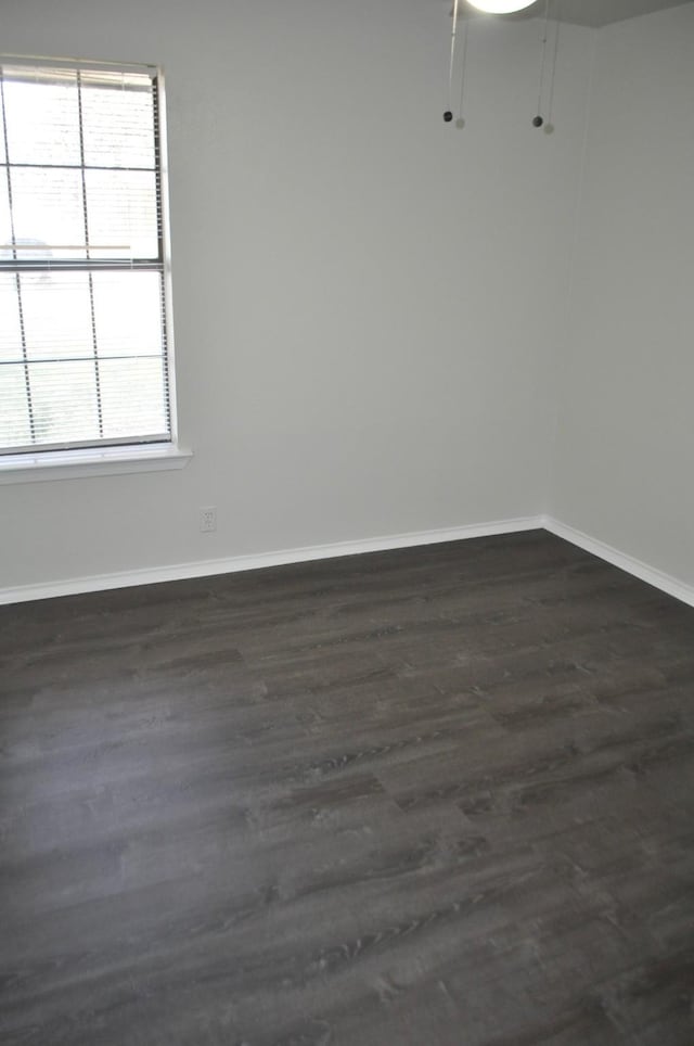 412 Poplar St, Italy, TX 76651 - unfurnished room with dark wood-type flooring and baseboards