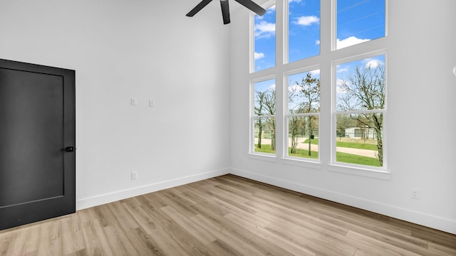 ZEPHYR2TBD Eagles Ridge Dr, Brock, TX 76087 - empty room with baseboards, wood finished floors, ceiling fan, and a towering ceiling