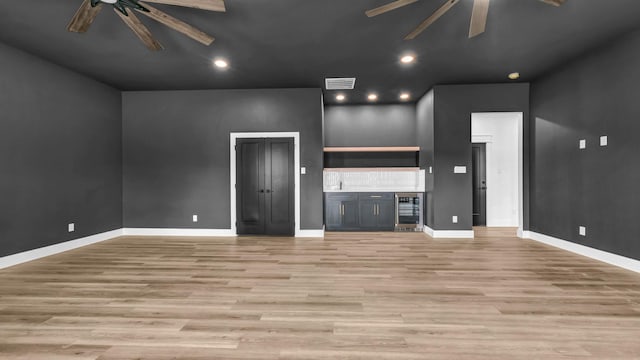 ZEPHYR2TBD Eagles Ridge Dr, Brock, TX 76087 - unfurnished living room with a ceiling fan, wine cooler, light wood finished floors, recessed lighting, and baseboards