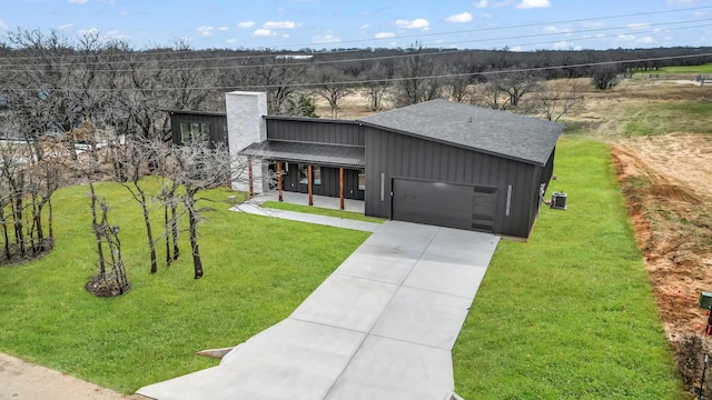 ZEPHYR2TBD Eagles Ridge Dr, Brock, TX 76087 - view of front of house featuring board and batten siding, a chimney, a front yard, and concrete driveway