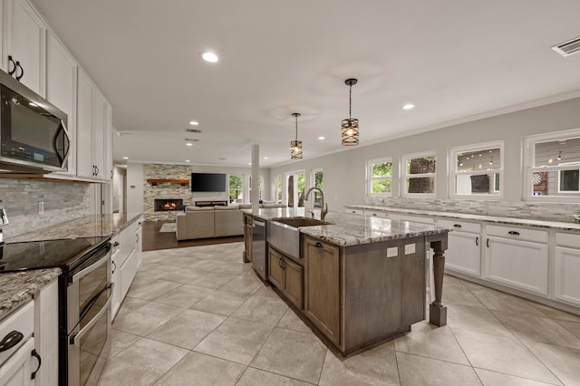 7313 Jo Will St, Colleyville, TX 76034 - kitchen with appliances with stainless steel finishes, a sink, tasteful backsplash, recessed lighting, and open floor plan