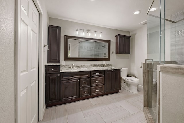 7313 Jo Will St, Colleyville, TX 76034 - full bathroom featuring toilet, double vanity, a shower stall, and recessed lighting