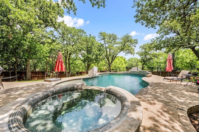 7313 Jo Will St, Colleyville, TX 76034 - view of swimming pool with a patio, a fenced backyard, a pool with connected hot tub, and view of scattered trees