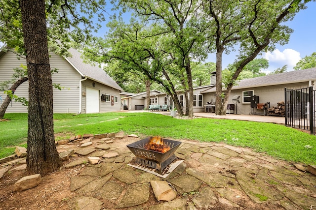 7313 Jo Will St, Colleyville, TX 76034 - view of grassy yard with a fire pit and a patio