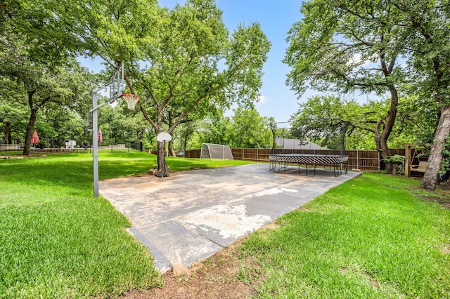 7313 Jo Will St, Colleyville, TX 76034 - view of yard with a trampoline and basketball hoop