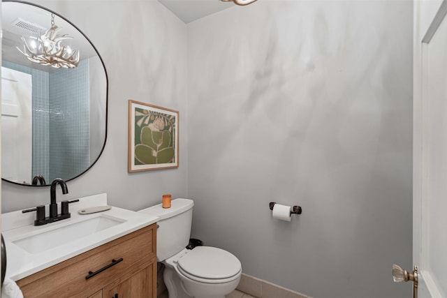 4233 Pershing Ave, Fort Worth, TX 76107 - bathroom with a chandelier, toilet, vanity, and tile patterned floors