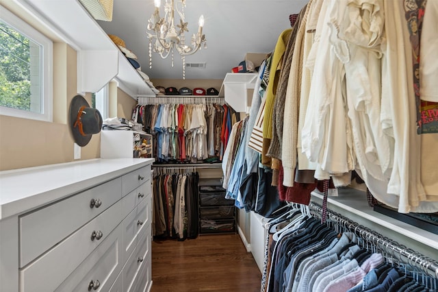 4233 Pershing Ave, Fort Worth, TX 76107 - spacious closet with a chandelier and dark wood-style flooring