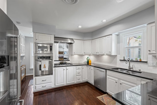4233 Pershing Ave, Fort Worth, TX 76107 - kitchen featuring appliances with stainless steel finishes, a sink, dark countertops, backsplash, and recessed lighting