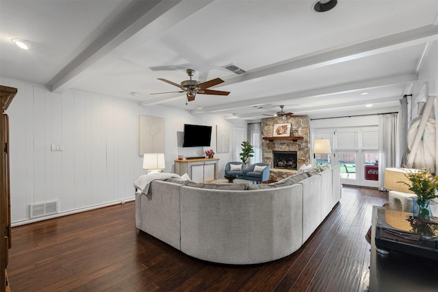 4233 Pershing Ave, Fort Worth, TX 76107 - living area featuring beam ceiling, ceiling fan, a stone fireplace, and dark wood-style floors