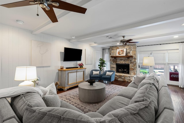 4233 Pershing Ave, Fort Worth, TX 76107 - living area with ceiling fan, wood finished floors, beam ceiling, and a stone fireplace
