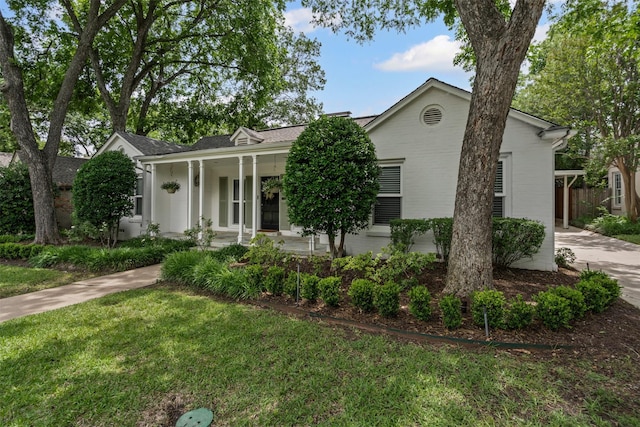 4233 Pershing Ave, Fort Worth, TX 76107 - ranch-style house featuring a front yard, a porch, and concrete driveway