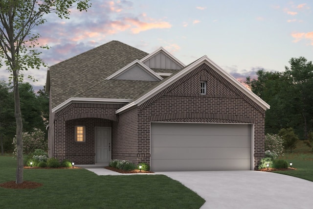 1805 Hazer Ln, Mesquite, TX 75149 - view of front of home with brick siding, driveway, and a front lawn