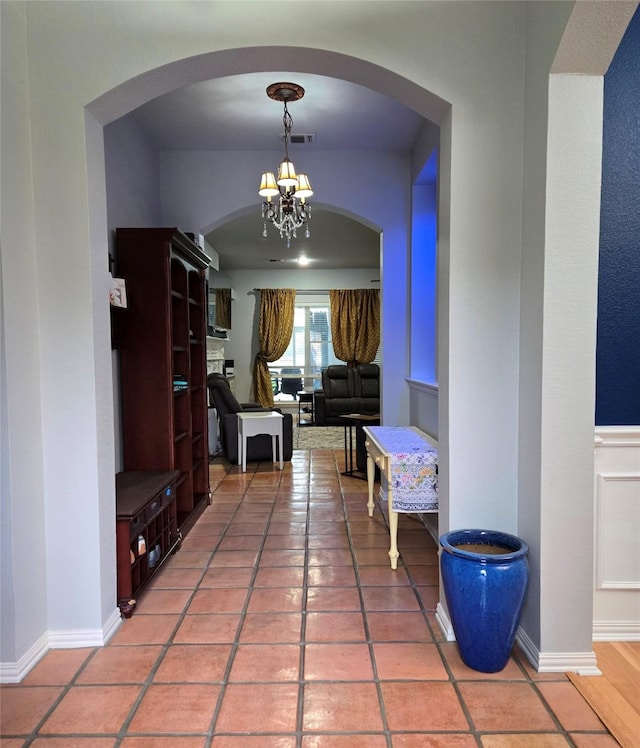 104 Olives Br, Shady Shores, TX 76208 - corridor featuring a chandelier and arched walkways