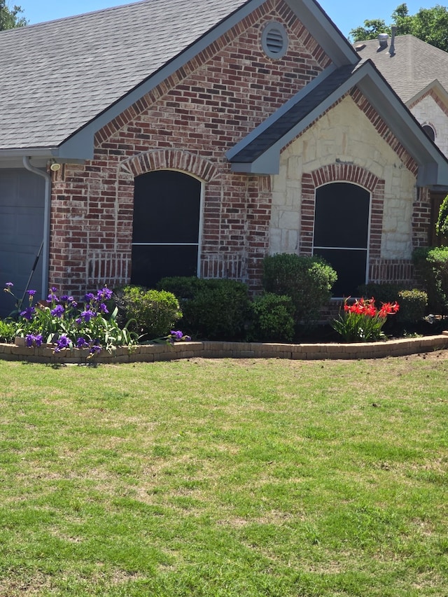 104 Olives Br, Shady Shores, TX 76208 - property entrance featuring brick siding, a yard, and roof with shingles