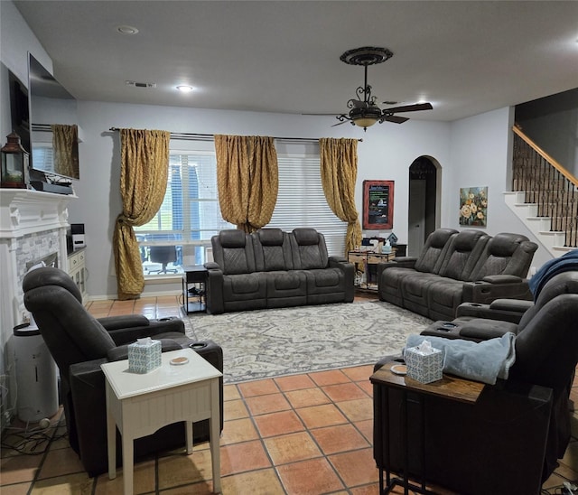 104 Olives Br, Shady Shores, TX 76208 - tiled living room featuring arched walkways, stairs, a fireplace, recessed lighting, and ceiling fan