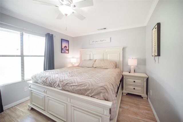 304 Moore St, Jacksboro, TX 76458 - bedroom featuring light wood finished floors, baseboards, ornamental molding, and a ceiling fan