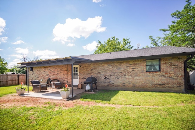 304 Moore St, Jacksboro, TX 76458 - rear view of house with a patio and brick siding