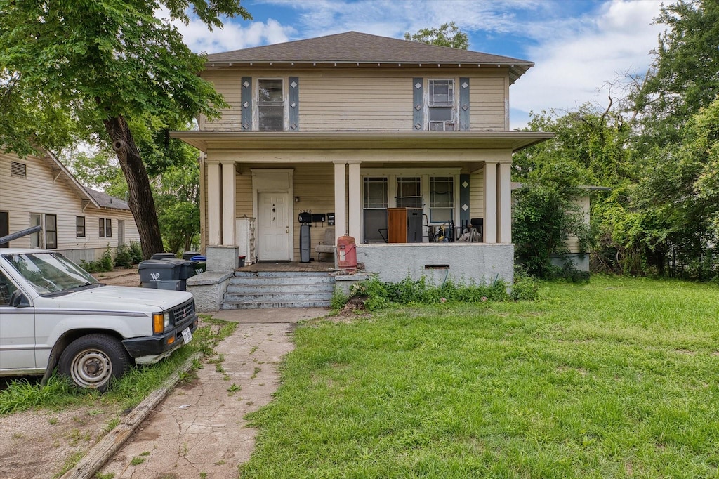 2220 Bosque Blvd, Waco, TX 76707 - american foursquare style home featuring a porch and a front lawn