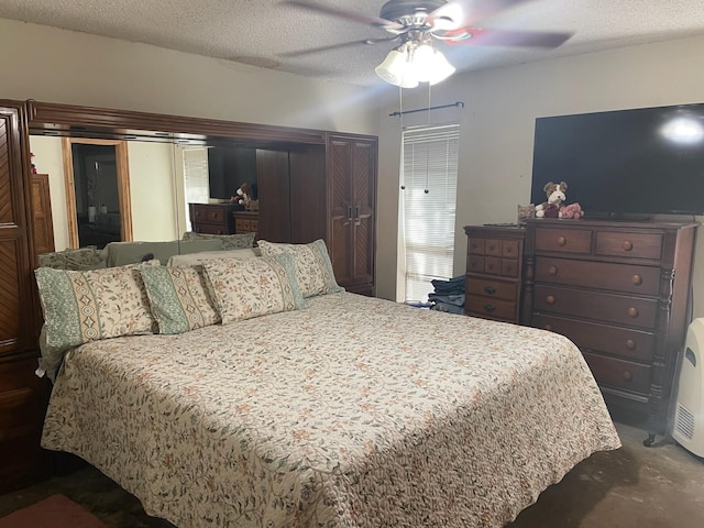 909 Mckinney Ave, Princeton, TX 75407 - bedroom with ceiling fan and a textured ceiling