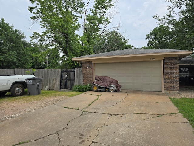 909 Mckinney Ave, Princeton, TX 75407 - garage featuring concrete driveway