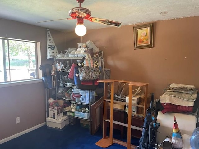 909 Mckinney Ave, Princeton, TX 75407 - bedroom with a textured ceiling, ceiling fan, baseboards, and carpet