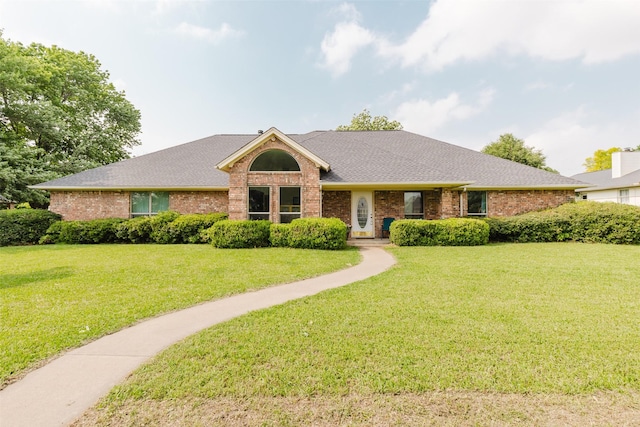 305 Brookview Dr, Decatur, TX 76234 - ranch-style house with brick siding, a front yard, and roof with shingles
