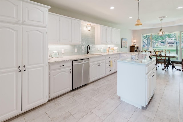 305 Brookview Dr, Decatur, TX 76234 - kitchen with stainless steel dishwasher, a sink, backsplash, decorative light fixtures, and white cabinets