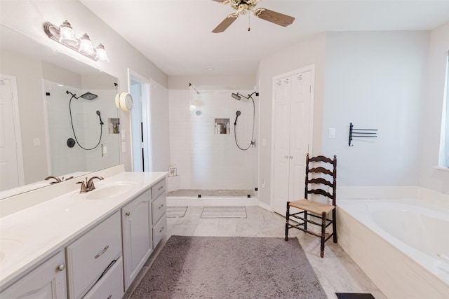305 Brookview Dr, Decatur, TX 76234 - full bath with tiled shower, vanity, a garden tub, and a ceiling fan