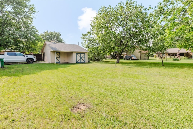 305 Brookview Dr, Decatur, TX 76234 - view of green lawn featuring an outdoor structure