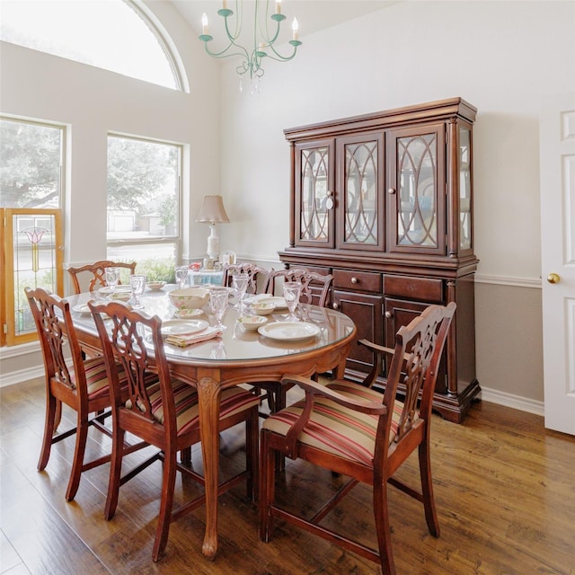 305 Brookview Dr, Decatur, TX 76234 - dining area featuring a chandelier, wood finished floors, and baseboards