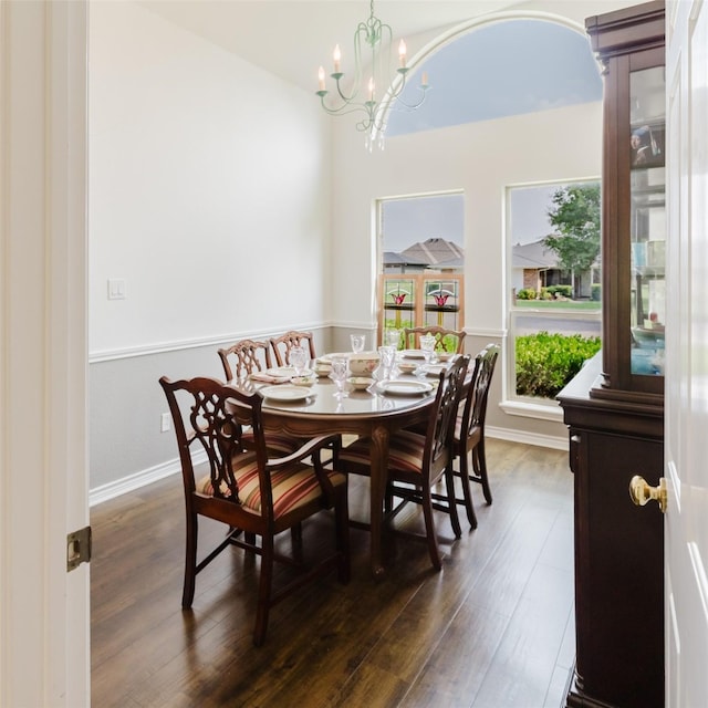 305 Brookview Dr, Decatur, TX 76234 - dining room featuring dark wood-style flooring, a chandelier, and baseboards